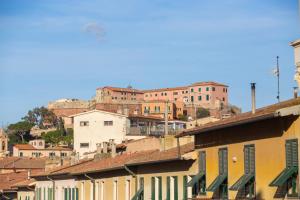 a group of buildings on top of a hill at L'acciughina in Portoferraio