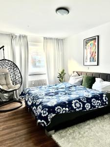 a bedroom with a bed and a chair and a window at Schlafzimmer der Stille in Bochum