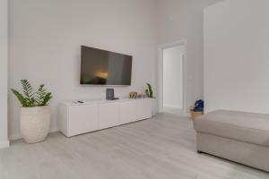 TV a/nebo společenská místnost v ubytování Graça House