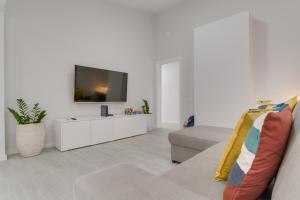 TV a/nebo společenská místnost v ubytování Graça House