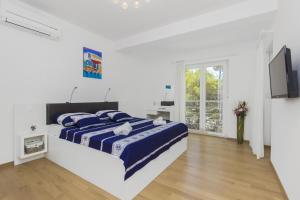Кровать или кровати в номере Apartment Royal