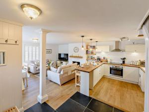 an open kitchen and living room with a couch at 2 Bed in Bideford 87991 in Parkham