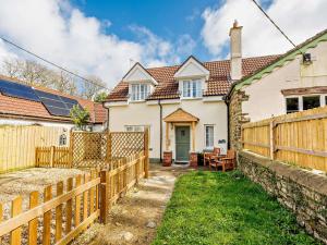 a home with a wooden fence and a yard at 2 Bed in Bideford 87991 in Parkham