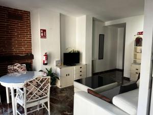 a living room with a couch and a table at Apartamento Centro in Granada