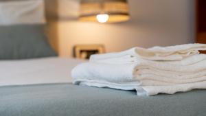 Postel nebo postele na pokoji v ubytování Lovely porto studios + 23 fotografií