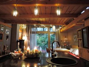 a kitchen with candles on a counter with a sink at Atelier Eliska in Staré Hory