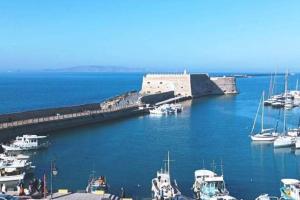 a group of boats are docked in a harbor at Traveller's Nest Studio close to center,port,airport in Heraklio