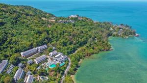 an aerial view of a resort on a hill next to the water at Namaka Resort Kamala in Kamala Beach