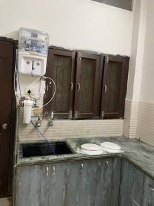 a bathroom with a sink with two toilets in it at Leela home stay - Lotus (2 BHK luxury appartment) in Jabalpur