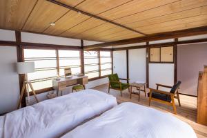 Postel nebo postele na pokoji v ubytování 深山邸miyama-tei