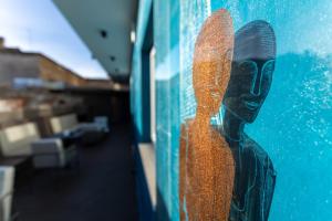 a reflection of a persons shoe on a wall at AXYHOTELS InnStyle Milano in Milan