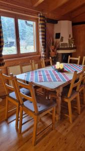 a dining room with a table and chairs in a cabin at Pension Bischof Lachtal in Lachtal