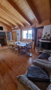 a large living room with a table and chairs at Pension Bischof Lachtal in Lachtal