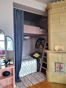 a bedroom with a bunk bed and a mirror at Lovely Vintage Suite in Helsinki