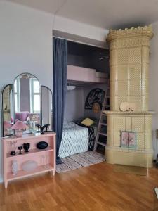 a bedroom with a bunk bed and a mirror at Lovely Vintage Suite in Helsinki