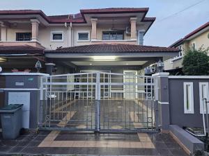 a gate in front of a house at Semi -D Homestay Seremban 2 in Seremban