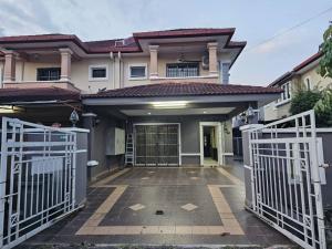 a house with a gate in front of it at Semi -D Homestay Seremban 2 in Seremban