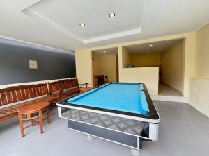 a pool table in the middle of a room at Dega Gardens in Canggu