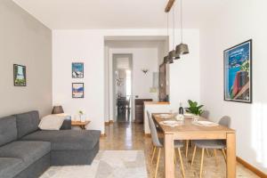 a living room with a couch and a table at Lake & The City in Como