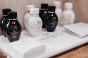 a group of four bottles of hair products on a counter at Paris Hotel Yerevan in Yerevan