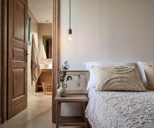 Postel nebo postele na pokoji v ubytování PHI Simple Living Quarters