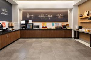 a fast food restaurant with a counter in a room at Hampton Inn by Hilton Nashville Airport Century Place in Nashville