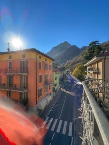 a car driving down a city street with buildings at Hotel Avogadro in San Pellegrino Terme
