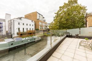 a view of a river from the balcony of a building at Central London Large 3bed 2bath with massive terrace overlooking grand union canal. (8 occupancy) in London