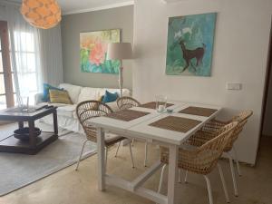 a white table and chairs in a living room at Apartment mit Traumblick in Sóller