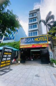 a hotel with signs in front of a building at Phú Gia 464 NVL in Ho Chi Minh City