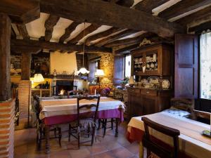 a kitchen and dining room with a table and chairs at Hotel Rural Zalama in San Pelayo - Merindad de Montija +35 photos