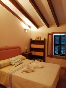 a bedroom with two beds and a window at YourHouse Cas Forner in Maria de la Salut