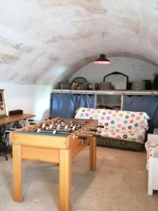 a chess table in a room with a couch at YourHouse Cas Forner in Maria de la Salut