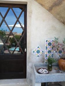 a door to a house with a view of the ocean at YourHouse Cas Forner in Maria de la Salut