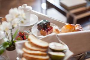 a tray of desserts and pastries on a table at Liassidi Wellness Suites in Venice