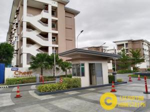 a building with orange traffic cones in front of it at C516 Place at SMDC Cheer Residences by Lee Portum in Marilao