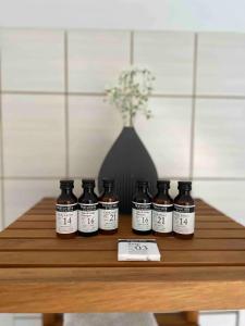 a group of bottles sitting on a wooden table at VOLLMER home in Titisee-Neustadt