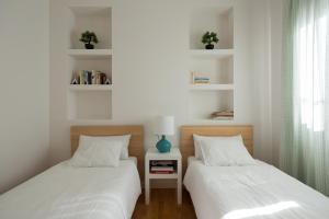 En eller flere senge i et værelse på Veoapartment Cervantes Terraza