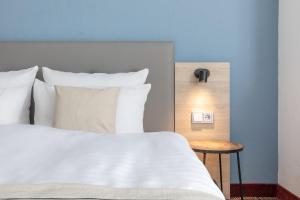 Postel nebo postele na pokoji v ubytování Hotel Ambassador Essen