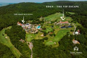 an aerial view of a golf course and the vip escape at Sungarden Golf & Spa Resort in Cluj-Napoca