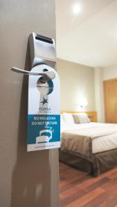 Posteľ alebo postele v izbe v ubytovaní Hotel Real