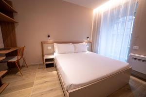 Ein Bett oder Betten in einem Zimmer der Unterkunft Be Mate Torino Centro