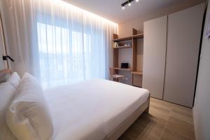 Ein Bett oder Betten in einem Zimmer der Unterkunft Be Mate Torino Centro