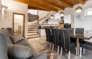 a kitchen and dining room with a table and chairs at Residence Panorama in Buzet