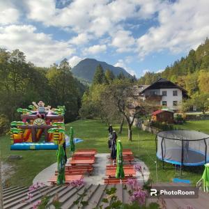 a view of a playground in a park at Hostel in picerija Špajza in Mojstrana