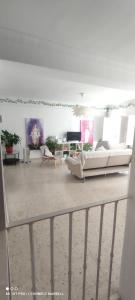 a living room with two couches and a tv at Big and cozy apartment with a big terrace in the center of the old town with AC from 2024 summer season in Marbella