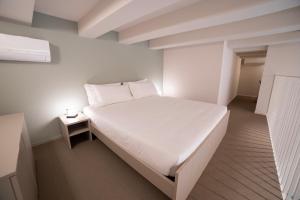 Ein Bett oder Betten in einem Zimmer der Unterkunft Be Mate Torino Centro