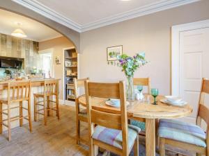 a kitchen and dining room with a table and chairs at 2 Bed in Ayton 77427 in Ayton