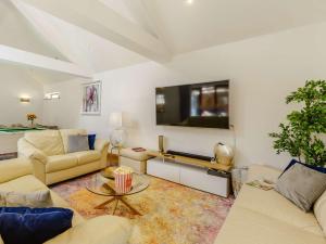 a living room with couches and a flat screen tv at 4 bed in Okehampton 83785 in Okehampton