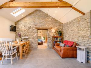 a living room with a stone wall at 3 bed in Pontardawe 88346 in Pontardawe